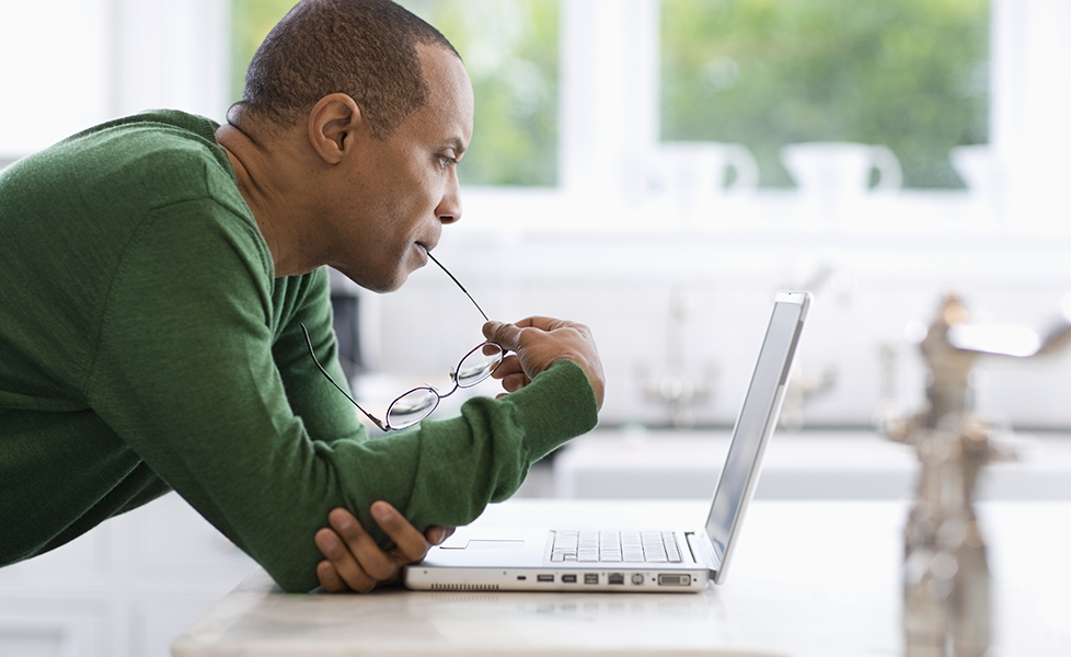 Man shopping on laptop by looking up search history